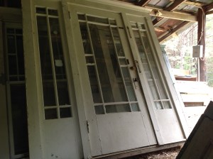 The bungalow's front door, stacked in the shed at "West of West."